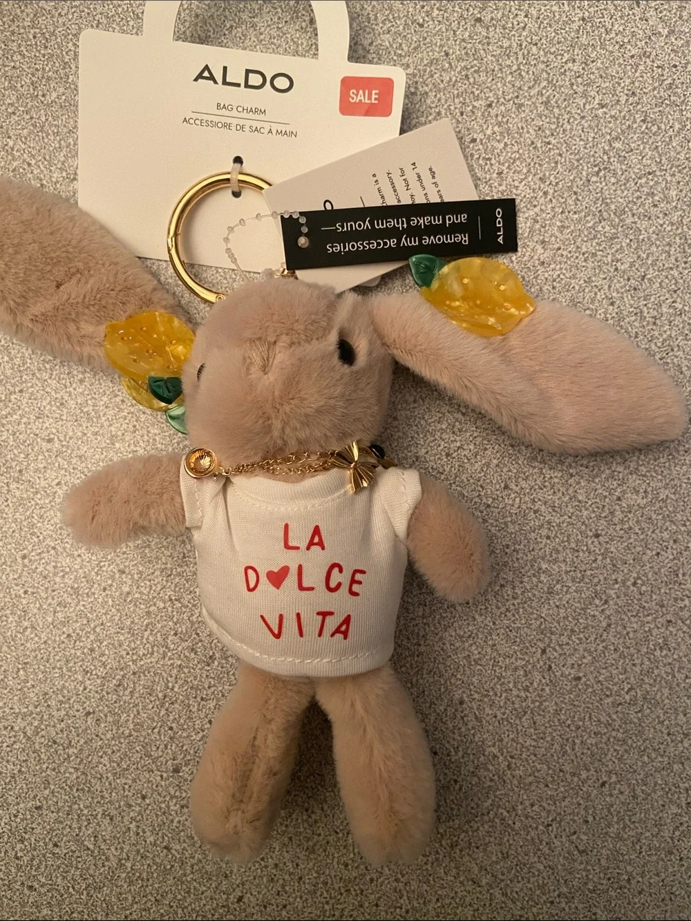 ALDO Beige Bunny Bag Charm with Yellow Leaf Accents
